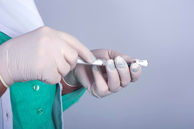 syringe in doctor hand close up