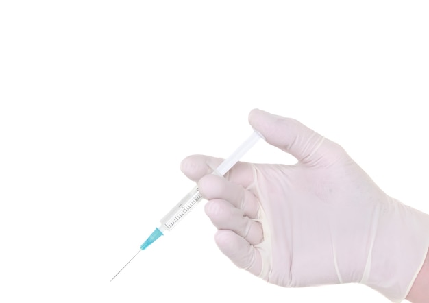 Syringe in a hand in medical gloves, , ready for injection with medication. white background