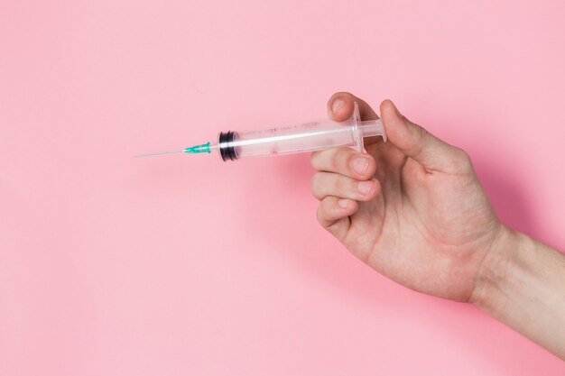 Syringe in a hand 