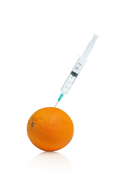 Syringe in orange on white background