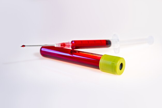 Syringe and tube with blood