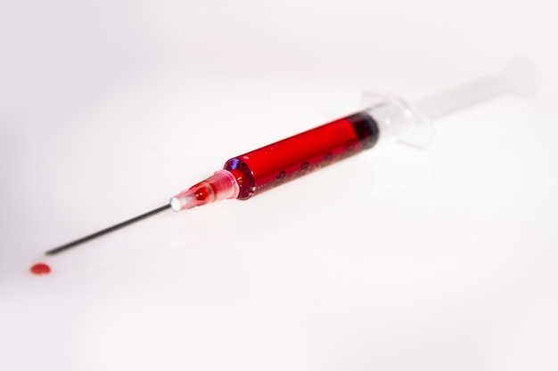 Syringe with blood