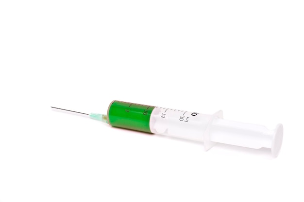 Syringe with green medication