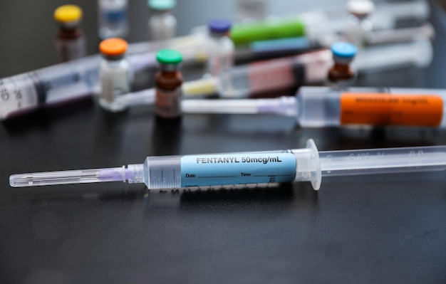 A syringe with the word " encrust " on it