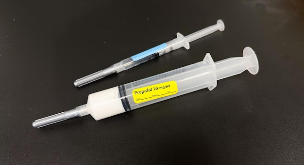 A syringe with a yellow label that says propane v2g.