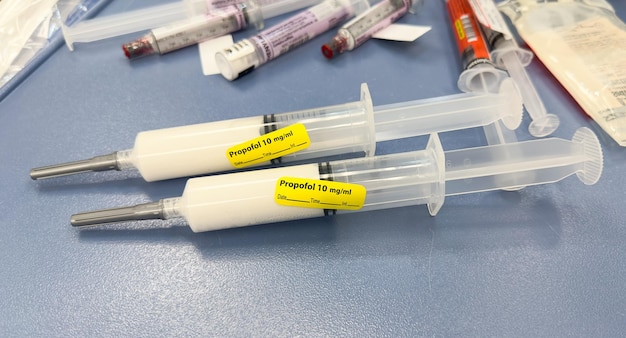 A syringe with a yellow sticker that says'froggy'on it