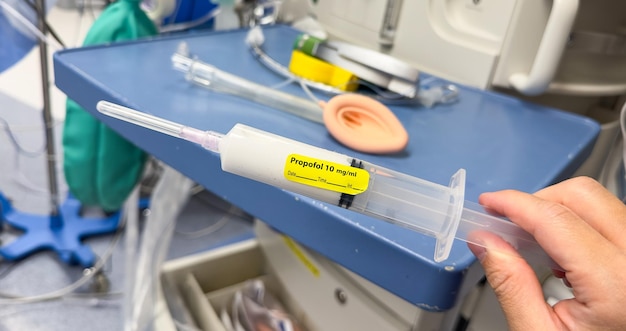 A syringe with a yellow sticker that says " warning 19 % " on it.