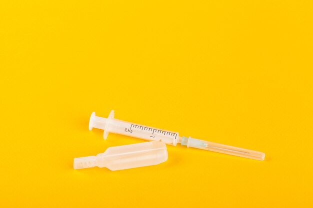 Syringe on yellow 