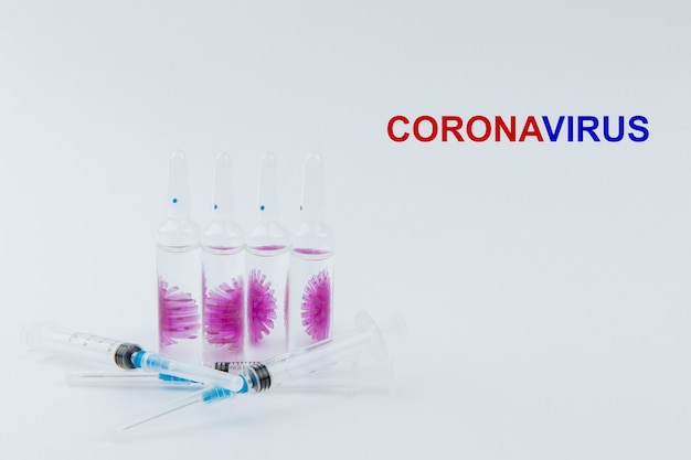 Syringes and ampoules with a vaccine against the virus covid-19.