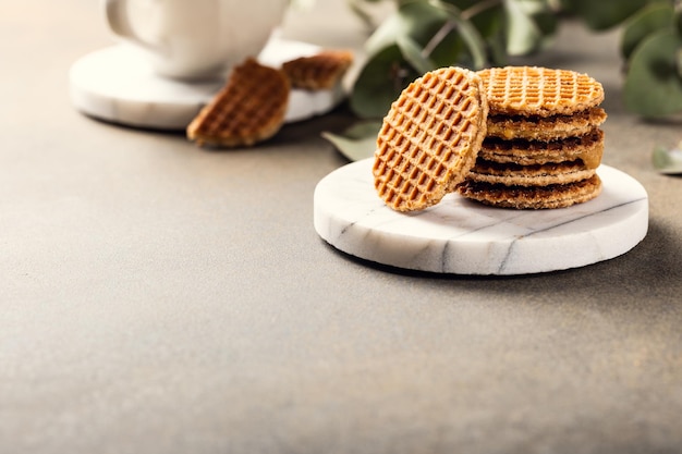 Syrupwaffles cookies and cup of tea