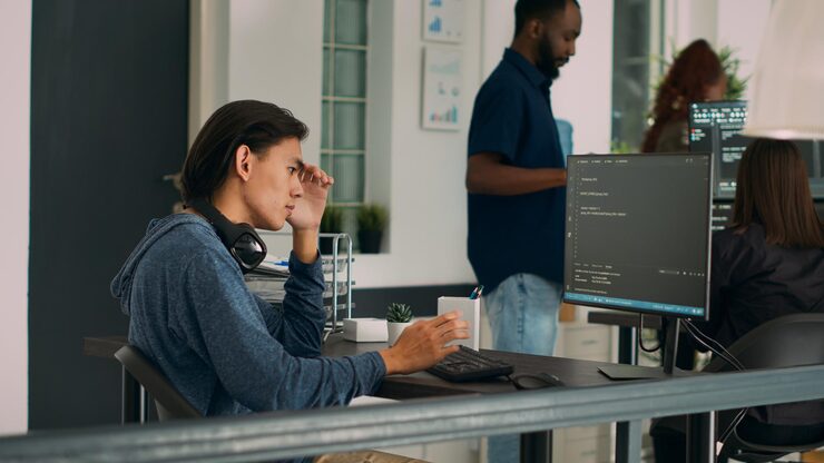 Photo system engineer working with html script on terminal window, looking at computer screen and typing. software developer in it office writing innovating ai algorithm and system programming.