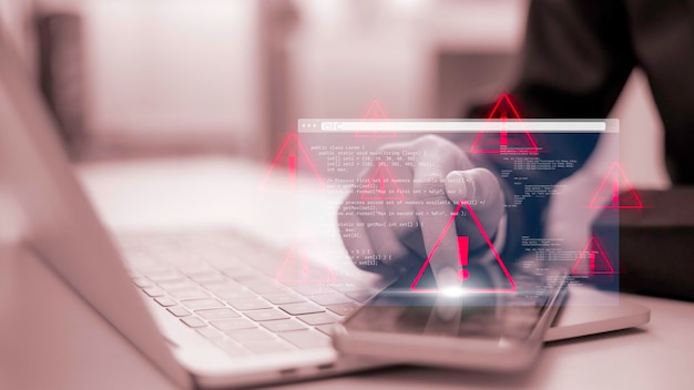 The system hacked the warning alert on the laptop Cyber attack on a computer network involving a virus spyware malware or other malicious software Cyber security and cybercrime alert