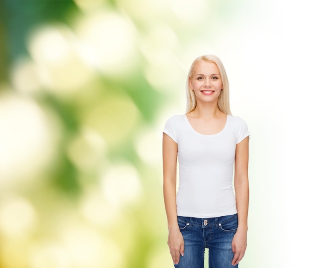 T-shirt design concept - smiling woman in blank white t-shirt