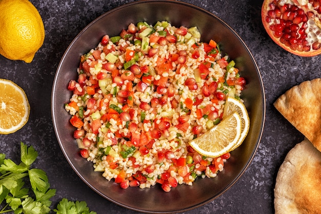 Tabbouleh salad on a black plate