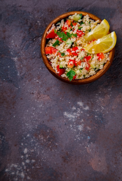 Tabbouleh salad with couscous on the plate.