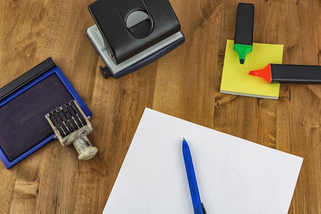 On the table are different office supplies