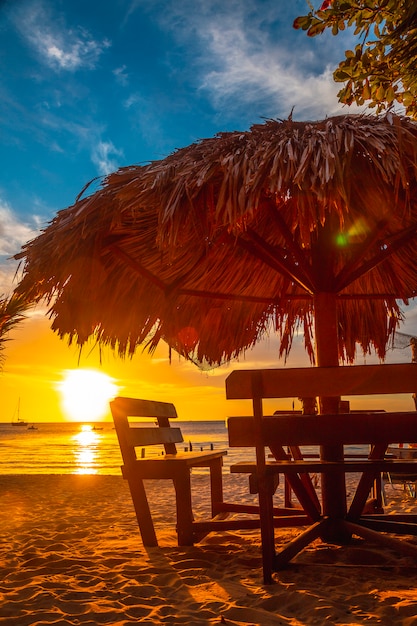 A table at the beach at Sunset on West End Beach, Roatan Island. Honduras