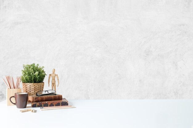 Table and chairs in basket against wall