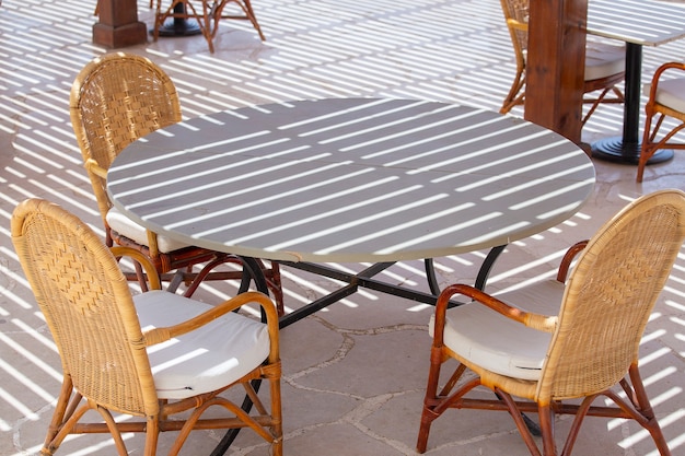 Table and chairs in beach cafe next to the red sea in Sharm el Sheikh, Egypt, close up