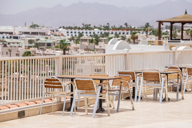 Table and chairs in beach cafe next to the red sea in Sharm el Sheikh Egypt