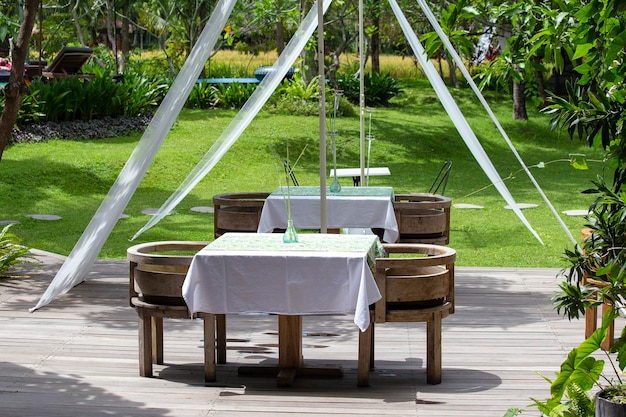 Table and chairs in the tropical garden Island Bali Ubud Indonesia