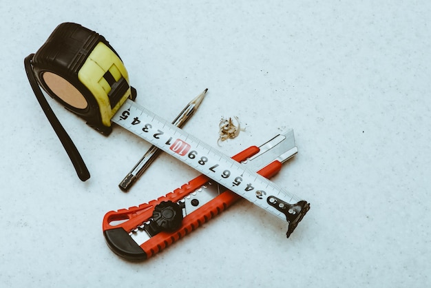 Table composition with roulette, pencil, cleric knife and shavings