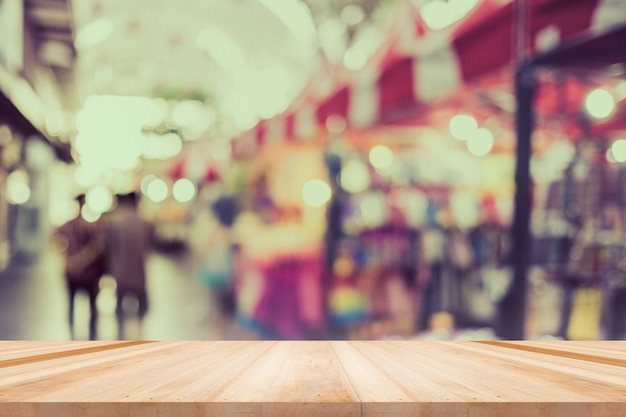 Table, counter at store, background for product display template, Empty wood desk, shelf, counter over blur retail shop with abstract bokeh light background, Wooden table top and blur store backdrop.