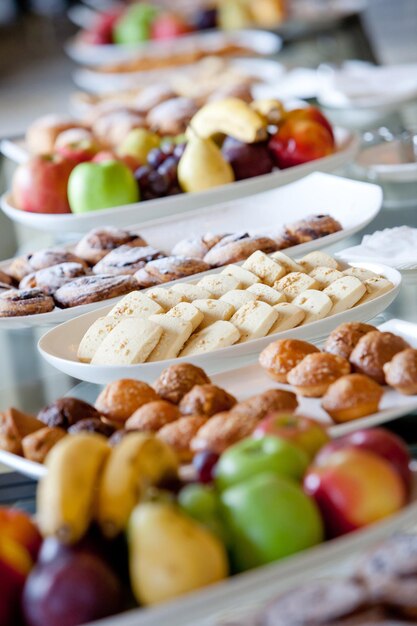 Table covered with cakes and fruits