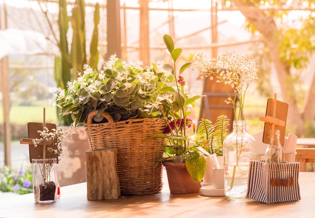 Table decorated with flower vases