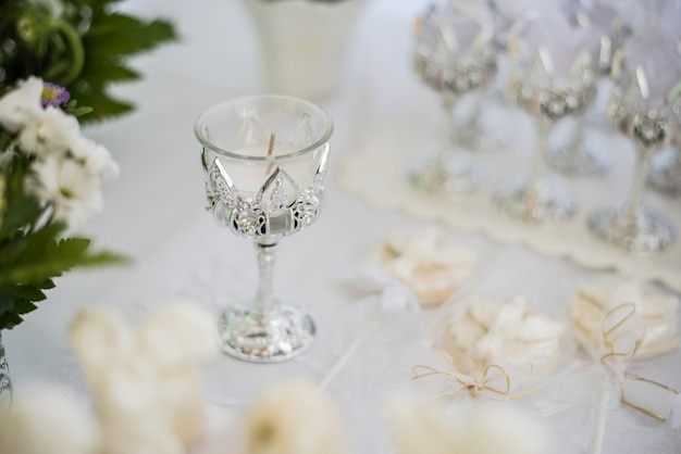 Table decorated with flowers, candy and decoration