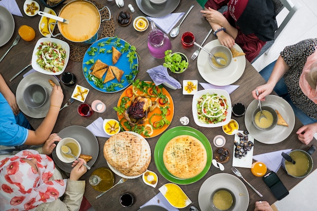 Table of enjoying food with family and friends top view