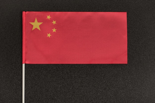 Table flag of China on black space. National symbol of Peoples Republic of China