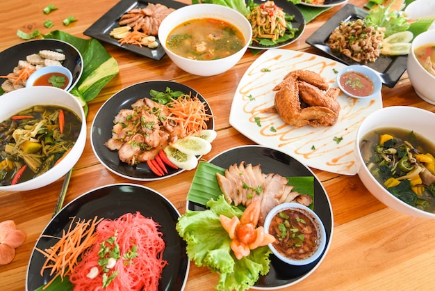 Table food served on plate Tradition northeast food Isaan delicious on plate with fresh vegetables Many variety various Thai menu Asian food 