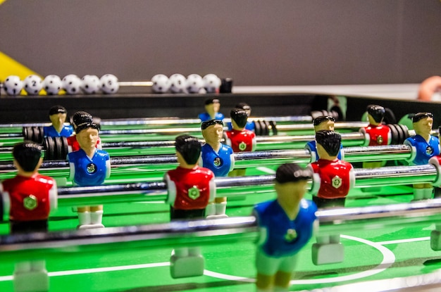 Table football soccer player figures on metal rods