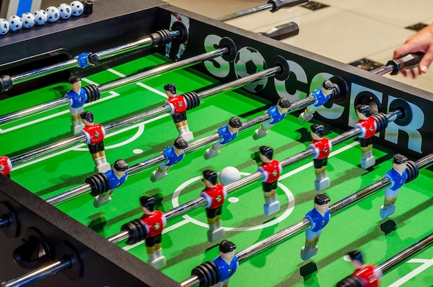 Table football soccer player figures on metal rods