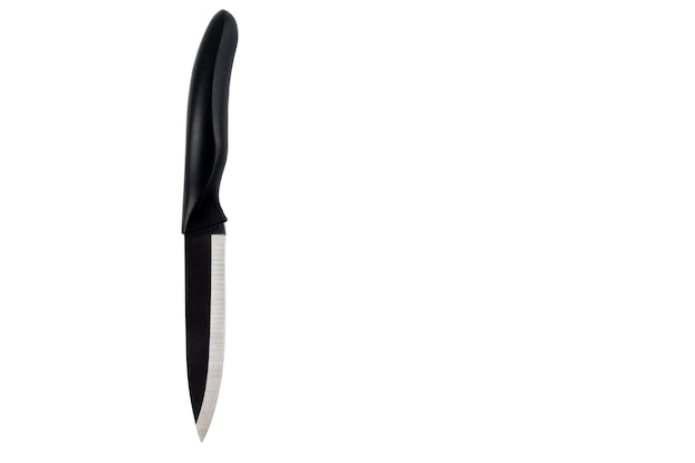 Table knife in black color isolated on a white desk