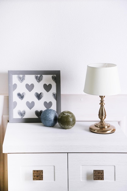 table lamp on commode in room