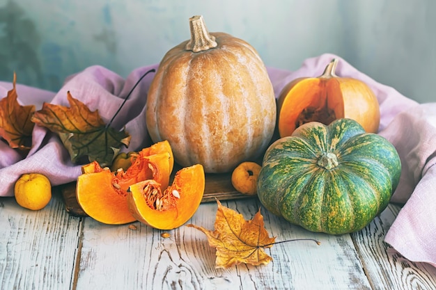 A table of pumpkins and other food including pumpkins