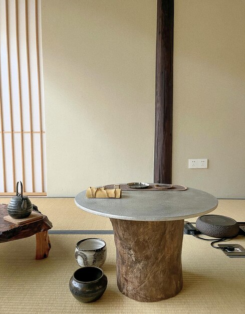 a table in a room with a wooden table and a pot on it