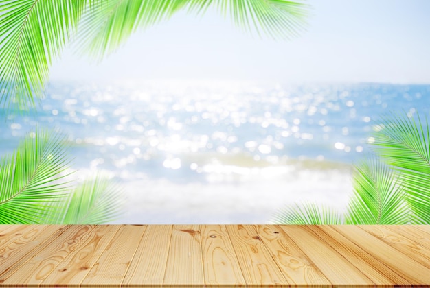 Table on sea with palm leaves backgroundempty desk wooden on blur blue ocean sand with bright whithe bokeh at coast mockup counter bar montage on blurry watertourism travel tropical summer holiday