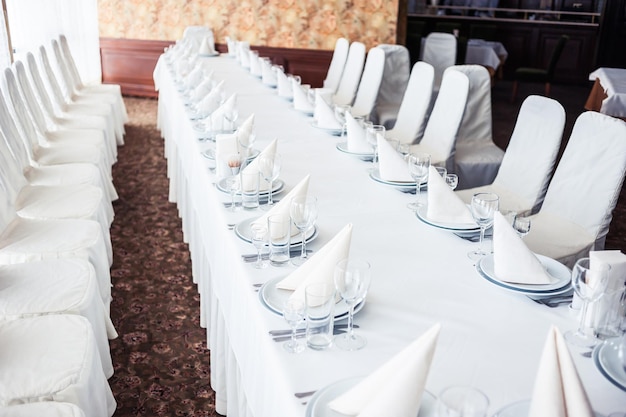 A table set for a wedding dinner in a restaurant