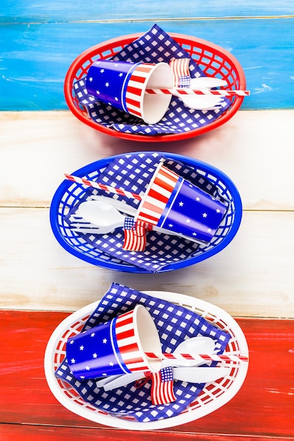 Table set with white, blue and red decorations for July 4th barbecue.