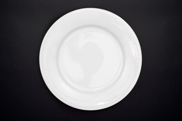 Table setting, Empty plate on black