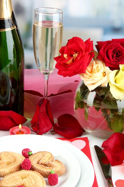 Table setting in honor of Valentine's Day on room background