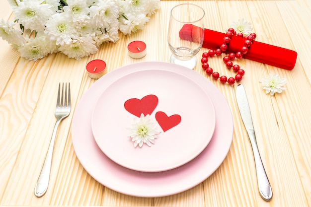 Table setting, love hearts, gift and flowers