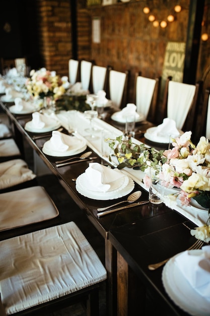 Table setting at rustic wedding reception.