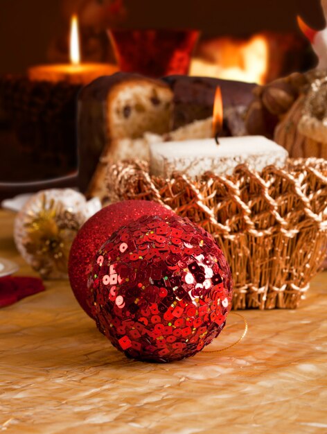 Table setting with candles and balls in traditional colors