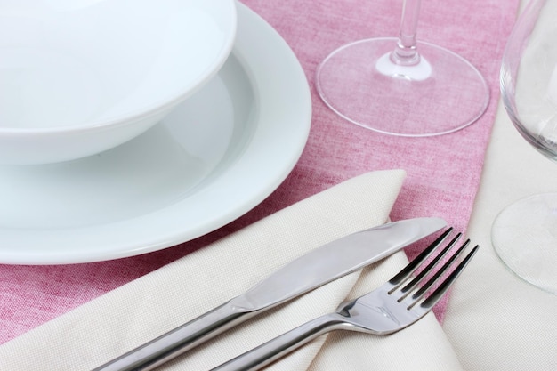 Table setting with fork knife plates and napkin