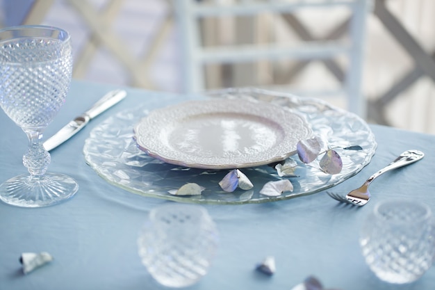 Table setting with glass candle holder