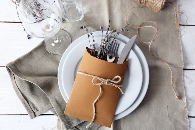 Table setting with lavender flowers, close-up